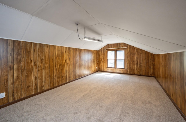 10476 Ricardo Rd, Clive, IA 50325 - bonus room with wooden walls, lofted ceiling, and light carpet