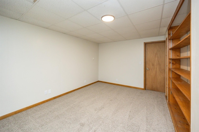 10476 Ricardo Rd, Clive, IA 50325 - unfurnished room with light carpet, baseboards, and a drop ceiling
