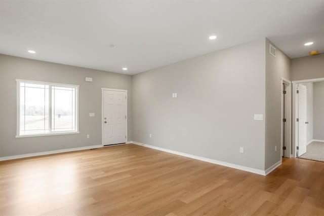 1006 Polk St, De Soto, IA 50069 - spare room with light wood-type flooring, baseboards, and recessed lighting