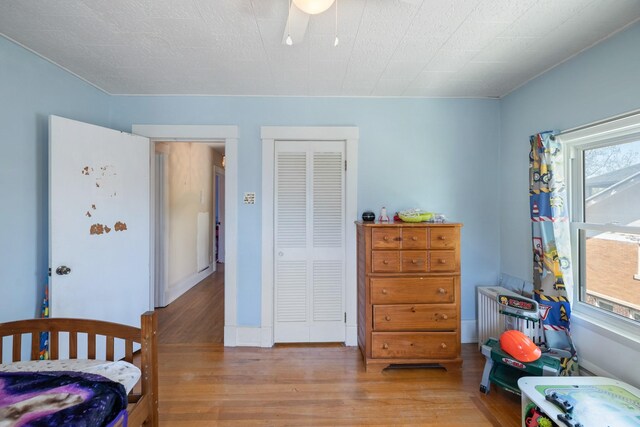 910 Washington St, Eldora, IA 50627 - bedroom featuring wood finished floors and a closet