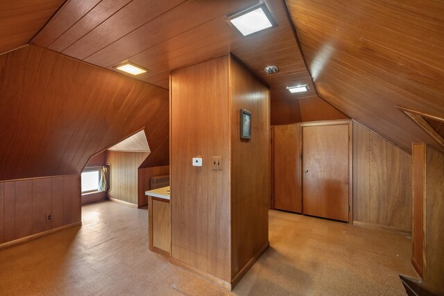 910 Washington St, Eldora, IA 50627 - bonus room featuring wood ceiling, lofted ceiling, and wood walls