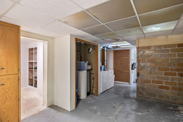 910 Washington St, Eldora, IA 50627 - finished below grade area featuring a water softener, washer and dryer, and a paneled ceiling