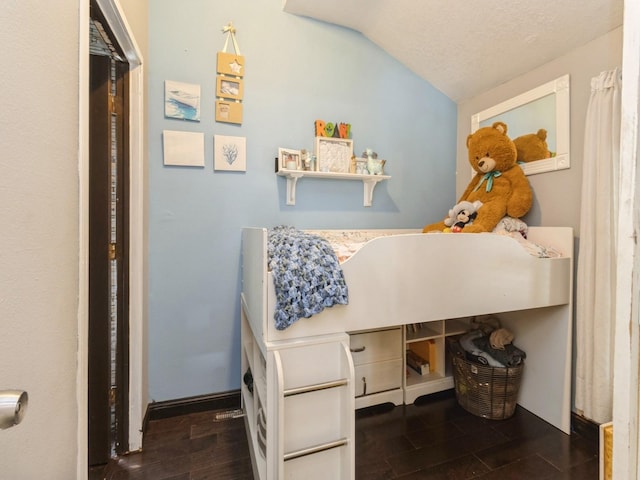 1273 E 18th St, Des Moines, IA 50316 - bedroom with vaulted ceiling and wood finished floors