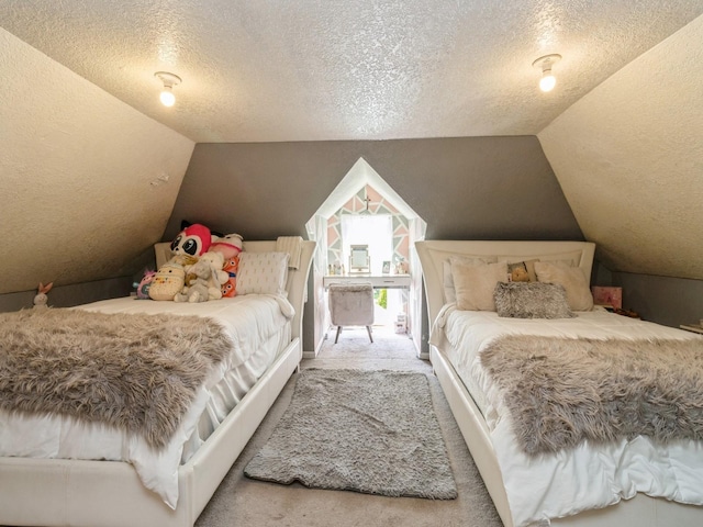 1273 E 18th St, Des Moines, IA 50316 - carpeted bedroom with a textured ceiling and lofted ceiling