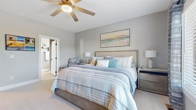 bedroom with light carpet, baseboards, a ceiling fan, and multiple windows