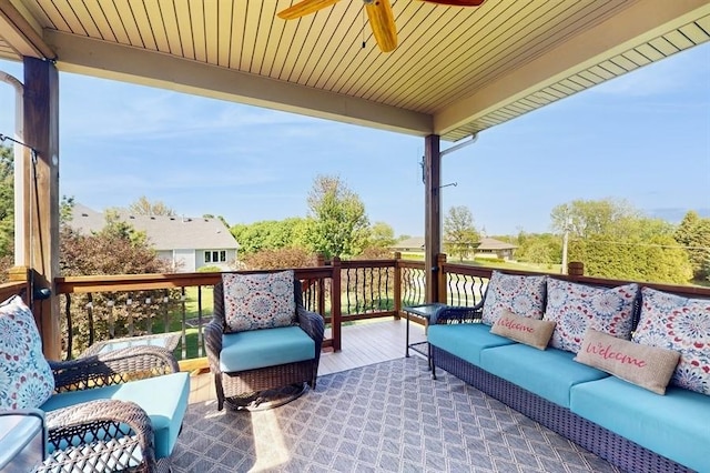 view of patio / terrace with outdoor lounge area, a ceiling fan, and a deck