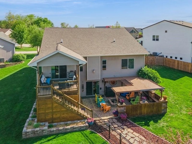 back of house featuring stairway, a shingled roof, and a patio
