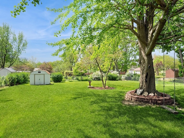 view of yard featuring a storage shed and an outdoor structure
