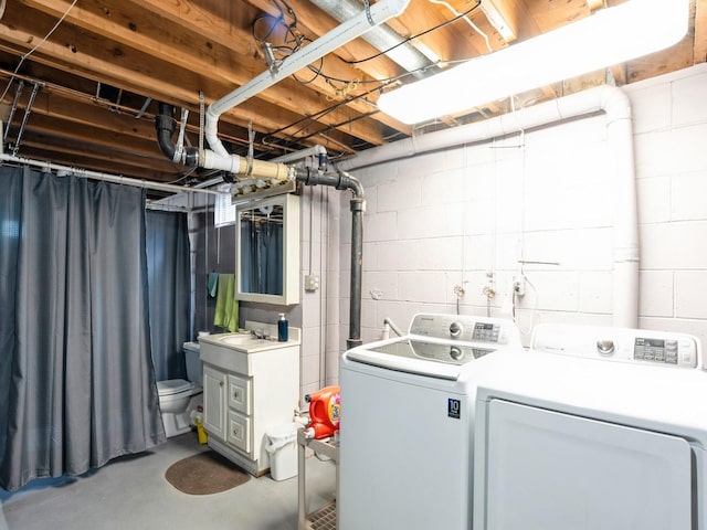 clothes washing area featuring washer and dryer