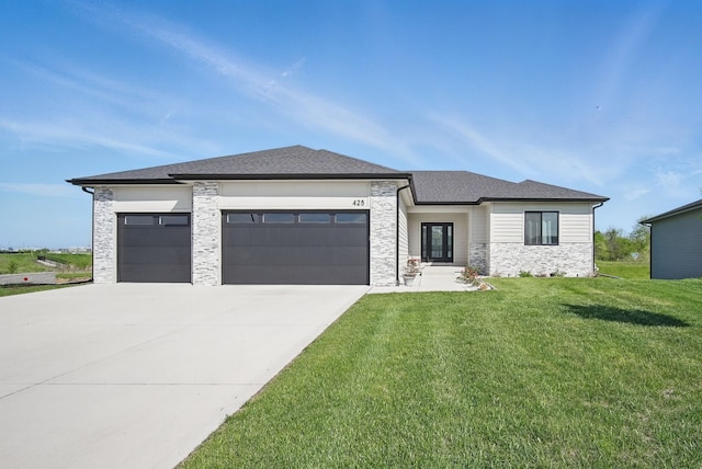 425 NW Woodmoor Dr, Waukee, IA 50263 - prairie-style home with a garage, concrete driveway, stone siding, and a front yard