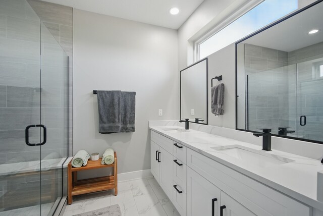 425 NW Woodmoor Dr, Waukee, IA 50263 - bathroom featuring marble finish flooring, baseboards, a shower stall, double vanity, and recessed lighting