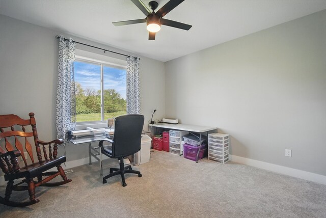 425 NW Woodmoor Dr, Waukee, IA 50263 - home office featuring light colored carpet, ceiling fan, and baseboards