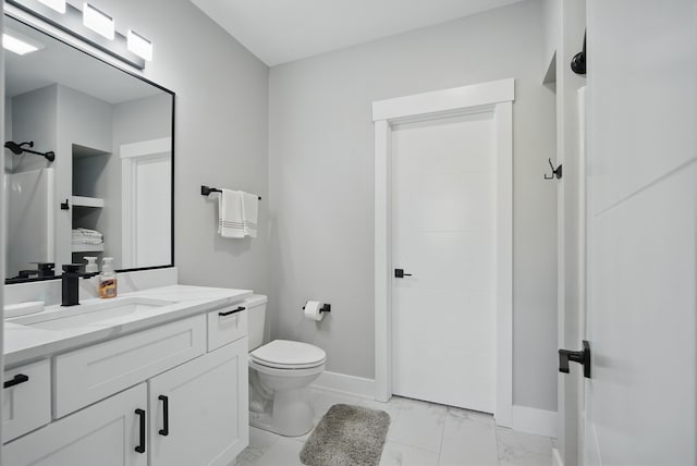 425 NW Woodmoor Dr, Waukee, IA 50263 - full bath with marble finish flooring, toilet, baseboards, and vanity