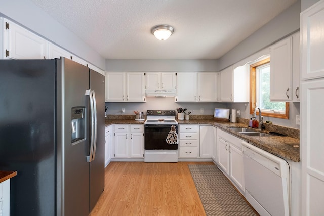 8123 Brookview Dr, Urbandale, IA 50322 - kitchen featuring white appliances, under cabinet range hood, white cabinetry, light wood-style floors, and dark stone counters