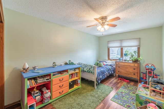 8123 Brookview Dr, Urbandale, IA 50322 - bedroom with a textured ceiling, wood finished floors, and a ceiling fan