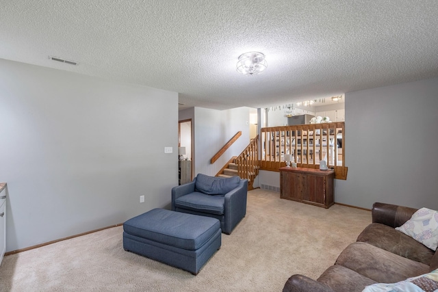 8123 Brookview Dr, Urbandale, IA 50322 - living room with carpet flooring, a textured ceiling, and stairs