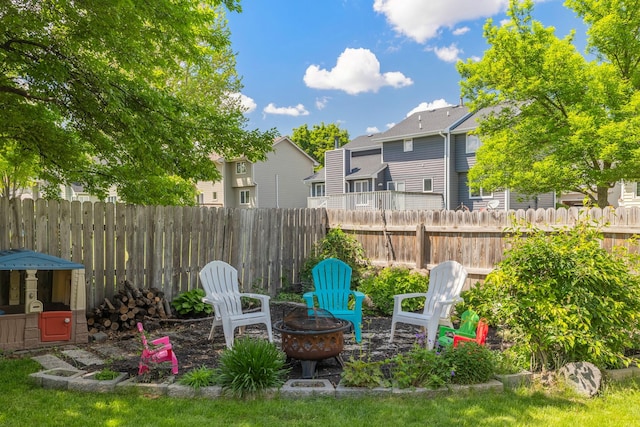 8123 Brookview Dr, Urbandale, IA 50322 - view of yard with an outdoor fire pit and a residential view