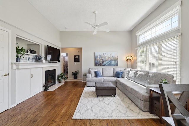 4400 Ep True Pkwy Unit 51, West Des Moines, IA 50265 - living area with ceiling fan, a fireplace with flush hearth, wood finished floors, and high vaulted ceiling