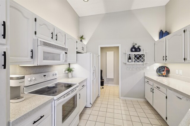4400 Ep True Pkwy Unit 51, West Des Moines, IA 50265 - kitchen with white appliances, white cabinets, and light tile patterned floors