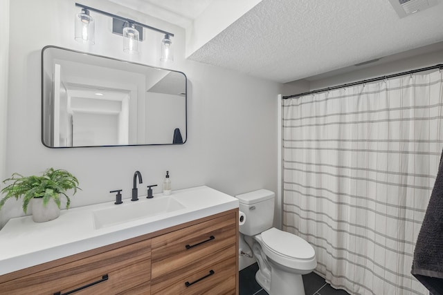 bathroom with toilet, vanity, a textured ceiling, tile patterned floors, and a shower with curtain