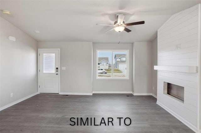 928 Spruce Ave, Norwalk, IA 50211 - unfurnished living room with a large fireplace, a ceiling fan, and wood finished floors