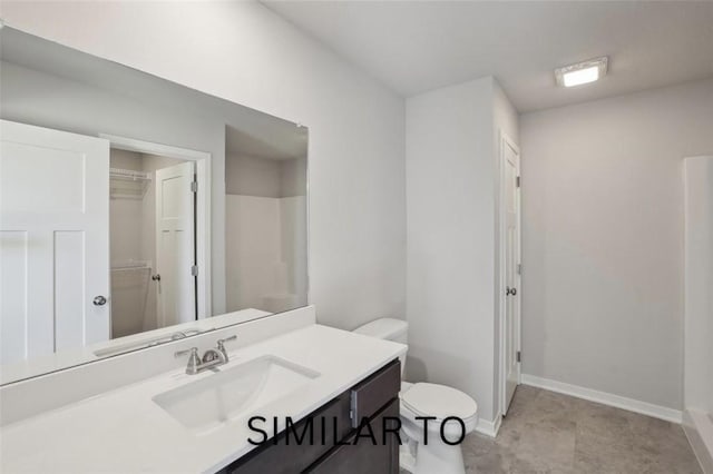928 Spruce Ave, Norwalk, IA 50211 - full bath featuring vanity, a spacious closet, and a shower