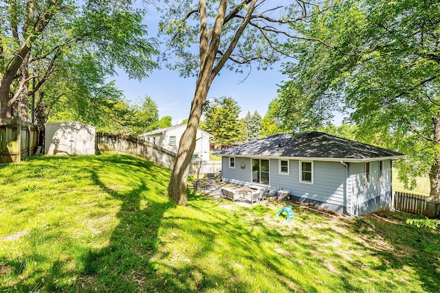 back of property with an outdoor structure and a storage unit