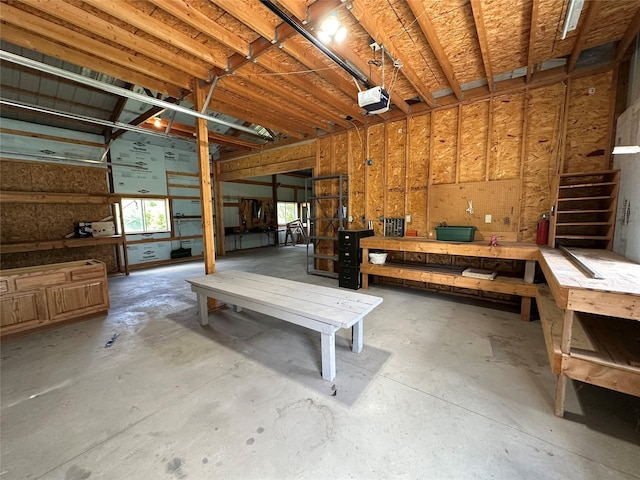 711 E Madison St, Winterset, IA 50273 - misc room with a workshop area and unfinished concrete flooring