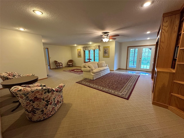 711 E Madison St, Winterset, IA 50273 - living room with carpet, a ceiling fan, a textured ceiling, baseboards, and recessed lighting