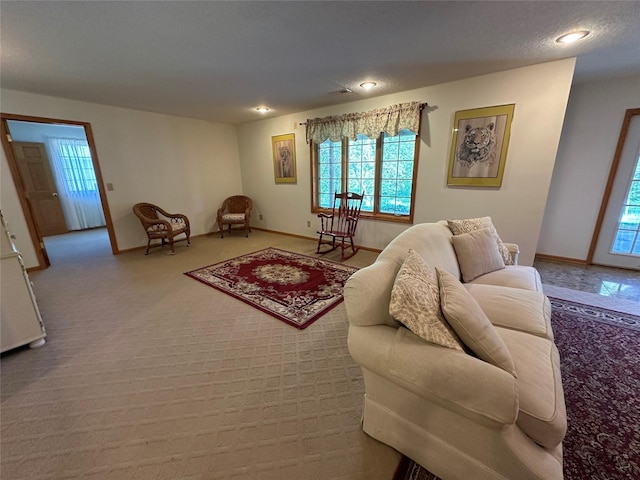 711 E Madison St, Winterset, IA 50273 - living room featuring healthy amount of natural light, baseboards, and recessed lighting