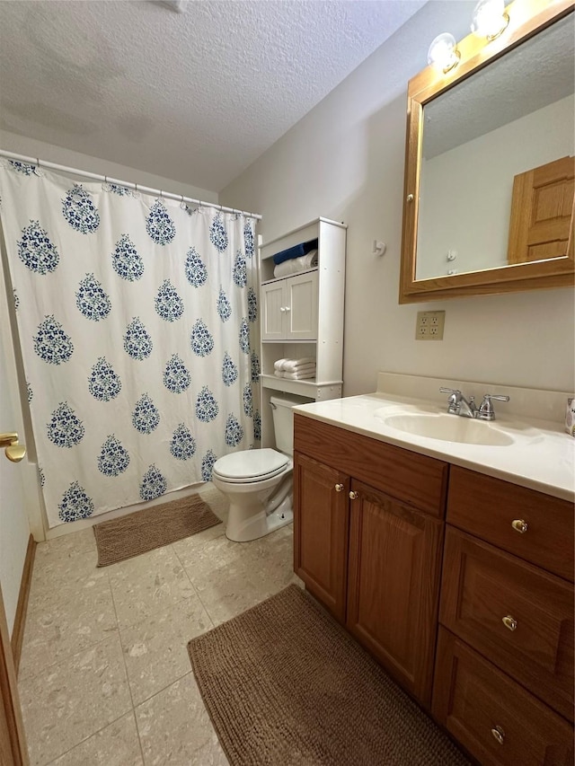 711 E Madison St, Winterset, IA 50273 - bathroom featuring toilet, vanity, tile patterned floors, a textured ceiling, and curtained shower