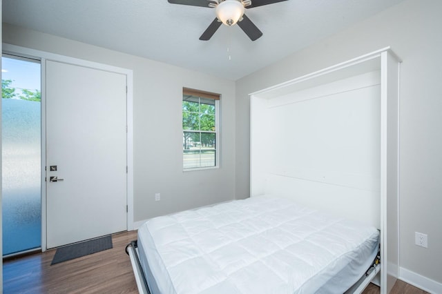 bedroom with wood finished floors and a ceiling fan
