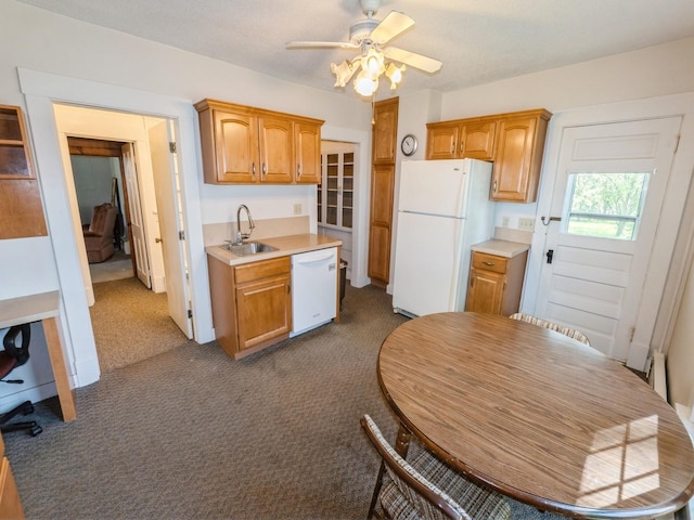 820 Main St, Norwalk, IA 50211 - kitchen featuring white appliances, a sink, light countertops, and a ceiling fan