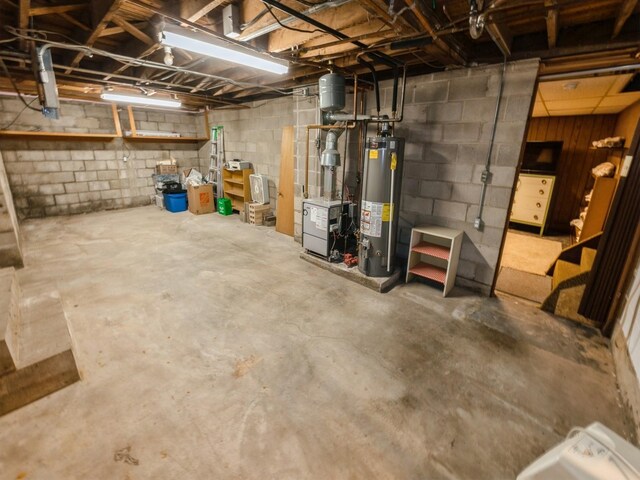 820 Main St, Norwalk, IA 50211 - unfinished basement with water heater, a heating unit, and concrete block wall