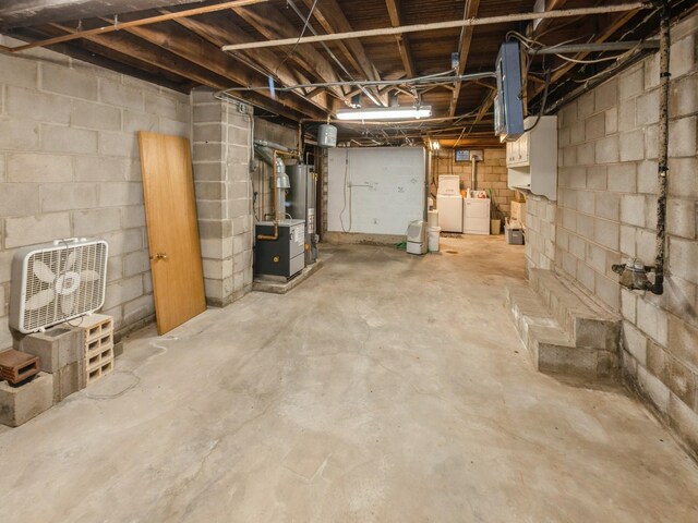 820 Main St, Norwalk, IA 50211 - unfinished basement featuring washer and clothes dryer and gas water heater