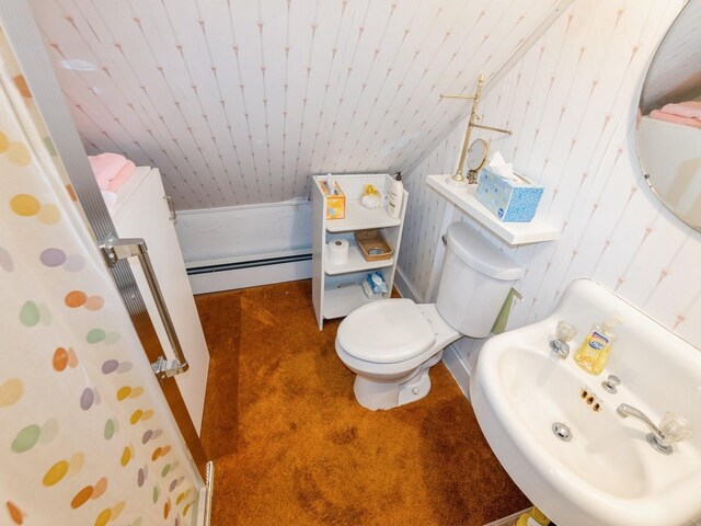 820 Main St, Norwalk, IA 50211 - full bathroom featuring baseboard heating, toilet, a sink, wooden ceiling, and baseboards