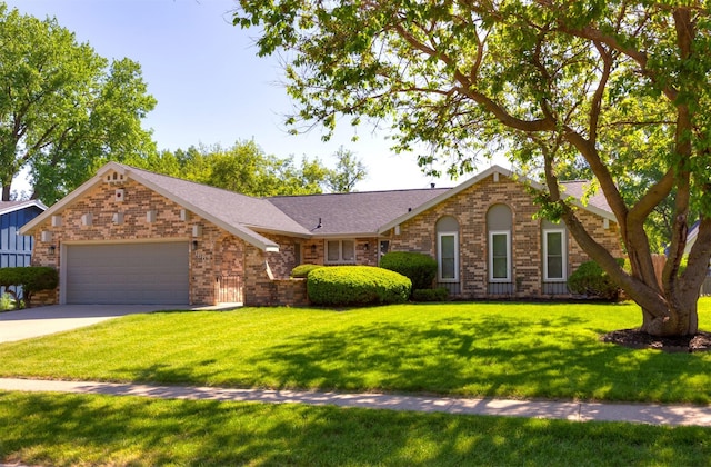 1667 NW 93rd Ct, Clive, IA 50325 - ranch-style home with brick siding, a garage, a front lawn, concrete driveway, and a shingled roof