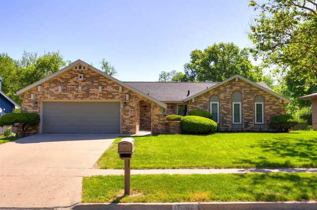 1667 NW 93rd Ct, Clive, IA 50325 - single story home featuring brick siding, a garage, concrete driveway, a front yard, and roof with shingles