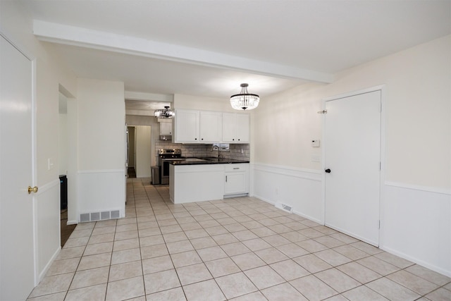 1667 NW 93rd Ct, Clive, IA 50325 - kitchen with dark countertops, stainless steel range with electric cooktop, beamed ceiling, tasteful backsplash, and white cabinetry