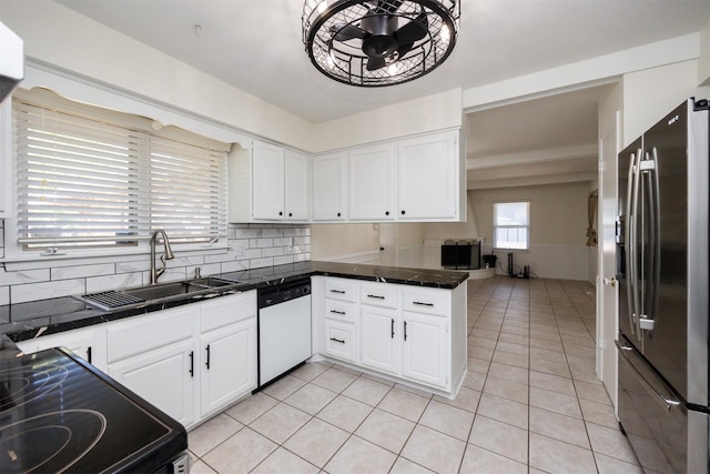 1667 NW 93rd Ct, Clive, IA 50325 - kitchen with stainless steel fridge with ice dispenser, white dishwasher, a sink, backsplash, and white cabinets