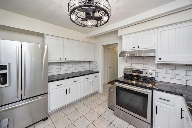 1667 NW 93rd Ct, Clive, IA 50325 - kitchen featuring stainless steel appliances, under cabinet range hood, dark countertops, and white cabinets