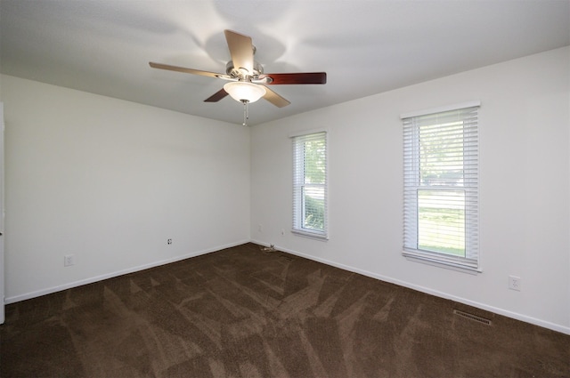 1667 NW 93rd Ct, Clive, IA 50325 - unfurnished room featuring a ceiling fan, dark colored carpet, and baseboards