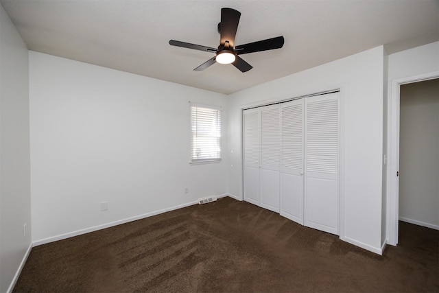 1667 NW 93rd Ct, Clive, IA 50325 - unfurnished bedroom featuring dark carpet, baseboards, and a closet