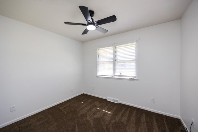 1667 NW 93rd Ct, Clive, IA 50325 - unfurnished room featuring dark carpet, baseboards, and ceiling fan