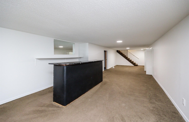 1667 NW 93rd Ct, Clive, IA 50325 - finished basement with carpet floors, stairs, baseboards, recessed lighting, and a textured ceiling