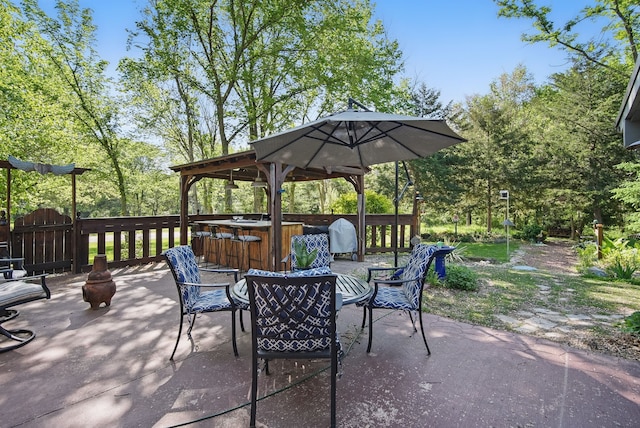 view of patio / terrace with a hot tub