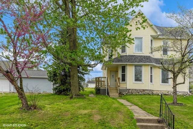 view of front of house featuring a shingled roof
