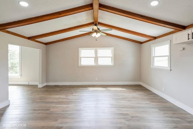 empty room featuring a ceiling fan, light wood-style flooring, baseboards, and recessed lighting