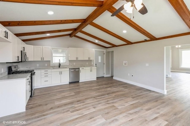 kitchen with appliances with stainless steel finishes, a sink, ceiling fan, light countertops, and recessed lighting