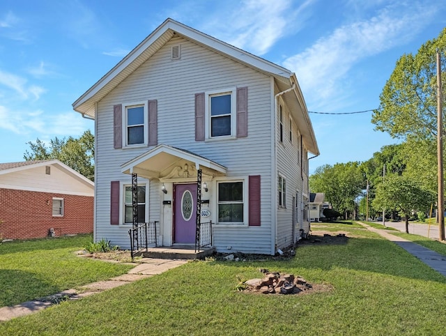 view of front of house with a front lawn